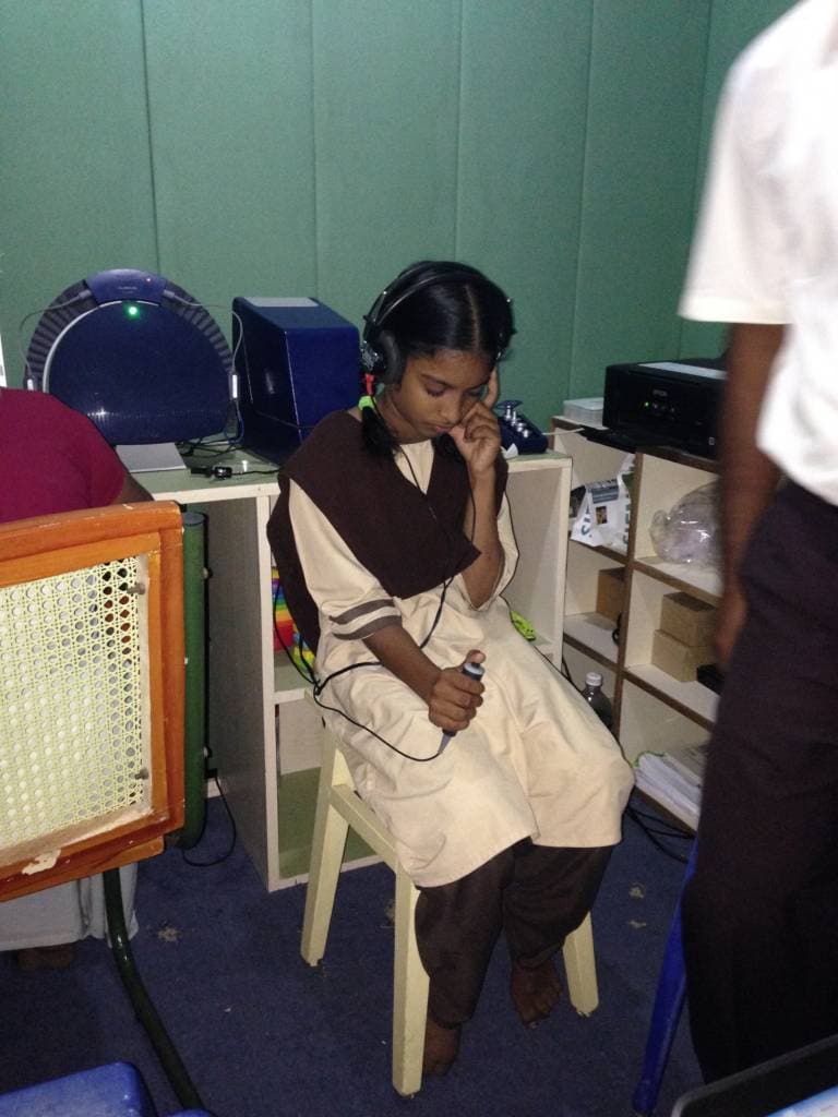 performing a hearing test in the Soundproof booth performing a hearing test in the Soundproof booth