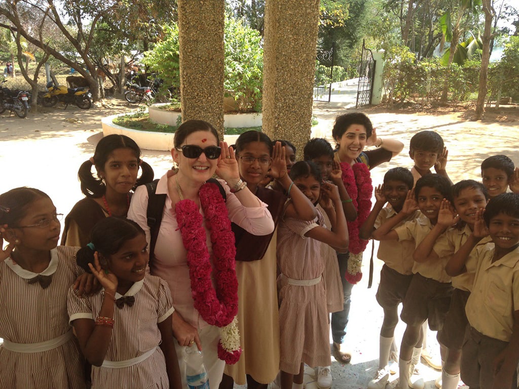 Anna-Crystal-and-the-children-doing-our-best-Hear-the-World-pose-resize
